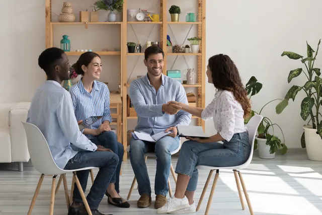Employer welcoming a new team member with a handshake