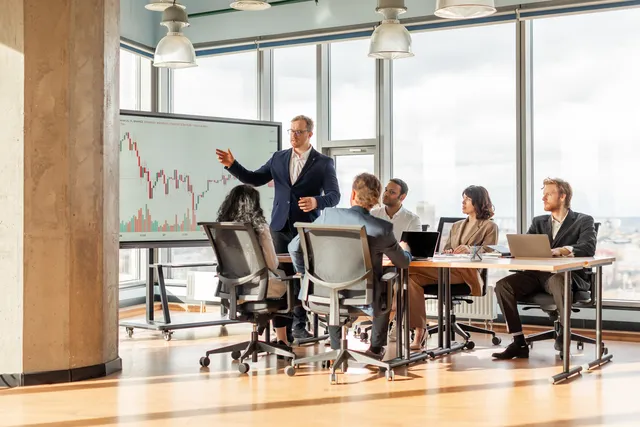Investors and founders in a bright office meeting